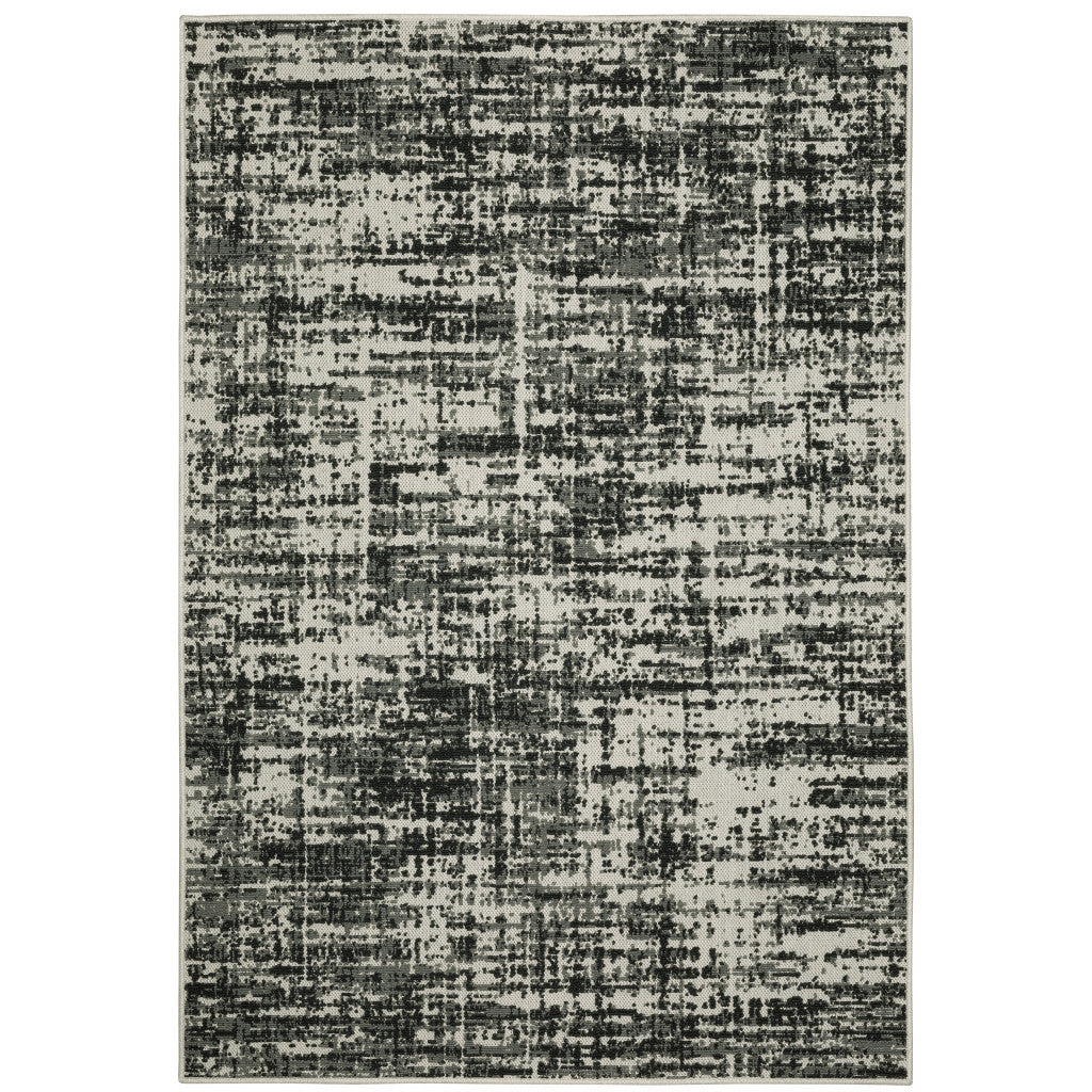 2' X 4' Beige and Black Abstract Stain Resistant Indoor Outdoor Area Rug