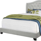 Tufted Light Gray Standard Bed Upholstered With Nailhead Trim And With Headboard