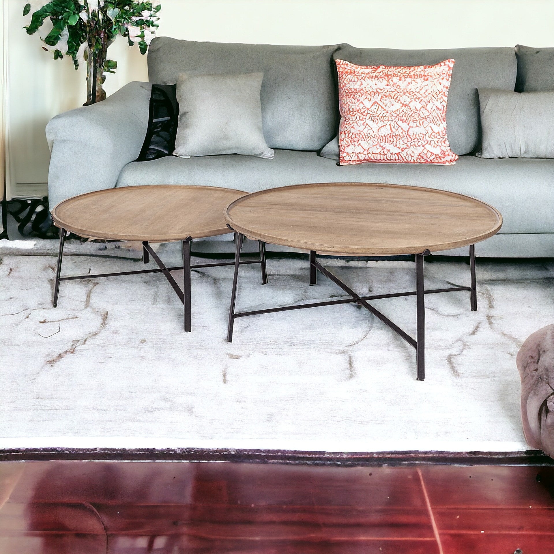 Set of Two 41" Brown And Black Solid Wood And Iron Round Nested Coffee Tables