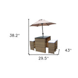 Six Piece Brown and White Faux Wicker Outdoor Bar Height Table Set with Umbrella and Stools