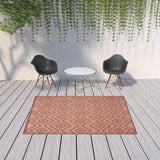 6' X 9' Coral Orange Argyle Indoor Outdoor Area Rug