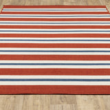 7' x 10' Red and Ivory Geometric Stain Resistant Indoor Outdoor Area Rug