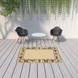 5' x 8' Brown and Ivory Abstract Stain Resistant Indoor Outdoor Area Rug