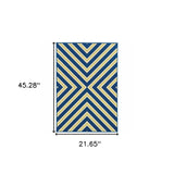 2' X 4' Blue and Ivory Geometric Stain Resistant Indoor Outdoor Area Rug