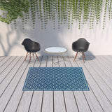 5' x 8' Blue and Ivory Geometric Stain Resistant Indoor Outdoor Area Rug