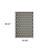 5' x 7' Beige and Black Geometric Stain Resistant Indoor Outdoor Area Rug