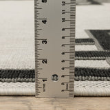 5' x 7' Beige and Black Stain Resistant Indoor Outdoor Area Rug