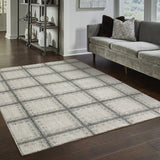 5' X 8' Grey Teal And Beige Geometric Power Loom Stain Resistant Area Rug