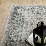 6' X 9' Grey Blue And Teal Oriental Power Loom Stain Resistant Area Rug