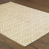 6' X 9' Gold And Ivory Geometric Power Loom Stain Resistant Area Rug