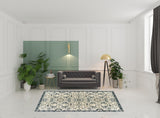 6' X 9' Ivory Navy And Gold Oriental Power Loom Stain Resistant Area Rug