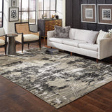 6' X 9' Black Gold Grey And Ivory Abstract Power Loom Stain Resistant Area Rug