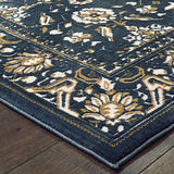 5' X 8' Navy Caramel And Ivory Oriental Power Loom Stain Resistant Area Rug