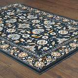 6' X 9' Navy Caramel And Ivory Oriental Power Loom Stain Resistant Area Rug