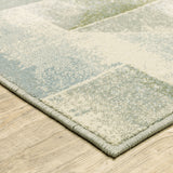 6' X 9' Blue Green Grey Gold And Ivory Geometric Power Loom Stain Resistant Area Rug