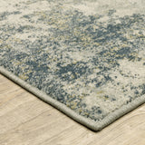 5' X 7' Beige Teal Grey And Gold Abstract Power Loom Stain Resistant Area Rug