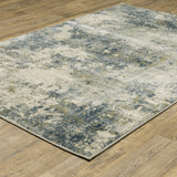 6' X 9' Beige Teal Grey And Gold Abstract Power Loom Stain Resistant Area Rug