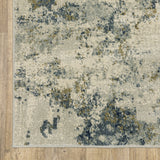 6' X 9' Beige Teal Grey And Gold Abstract Power Loom Stain Resistant Area Rug