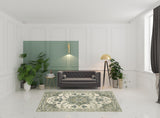 6' X 9' Ivory Blue Teal Grey And Olive Green Oriental Power Loom Stain Resistant Area Rug