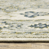 6' X 9' Ivory Blue Teal Grey And Olive Green Oriental Power Loom Stain Resistant Area Rug