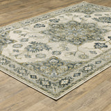 6' X 9' Ivory Blue Teal Grey And Olive Green Oriental Power Loom Stain Resistant Area Rug