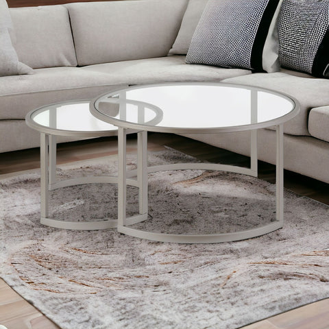 Set of Two 36" Nickel Glass And Steel Round Nested Coffee Tables