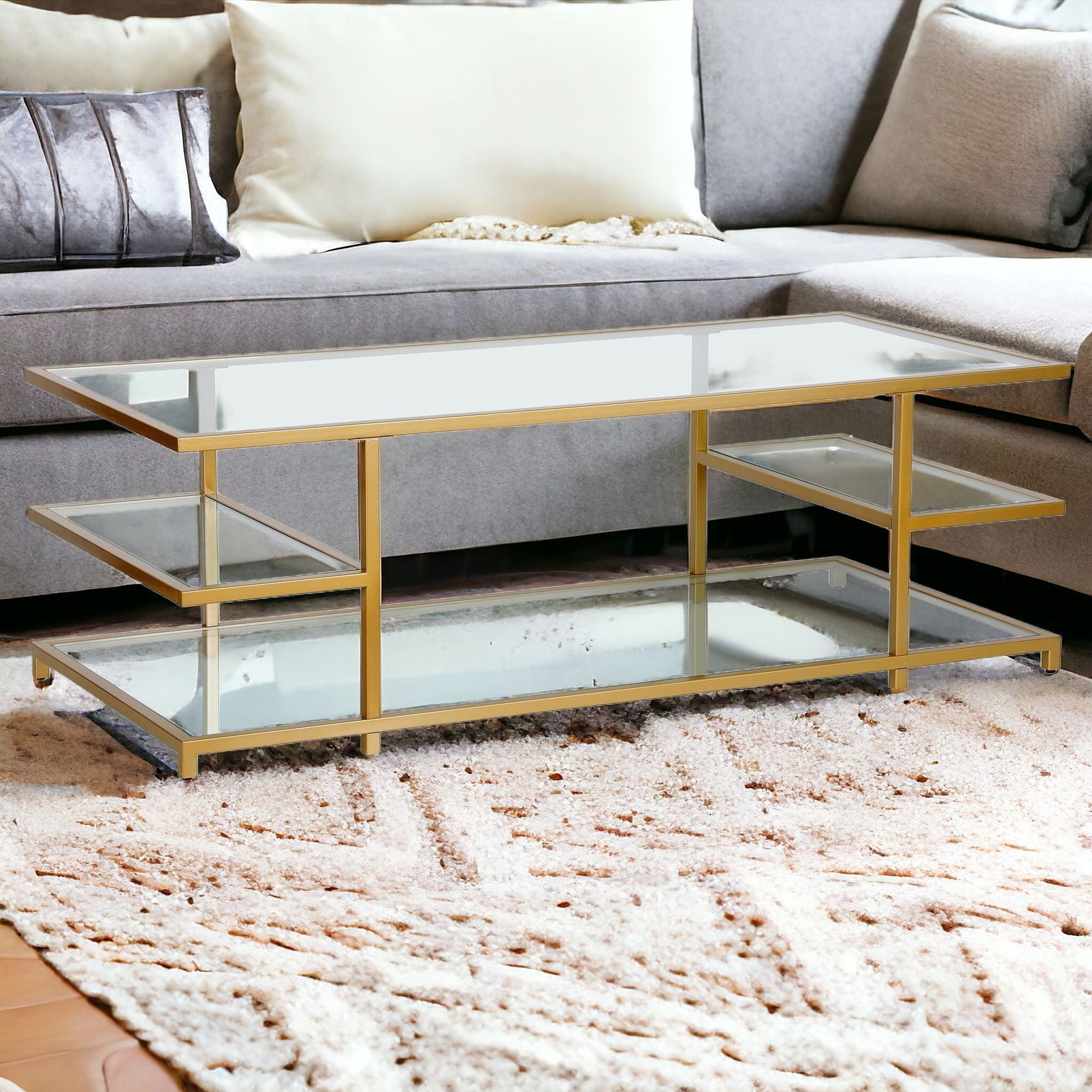 54" Gold Glass And Steel Coffee Table With Three Shelves