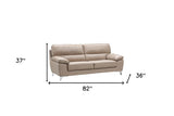 64" Beige And Silver Faux Leather Love Seat